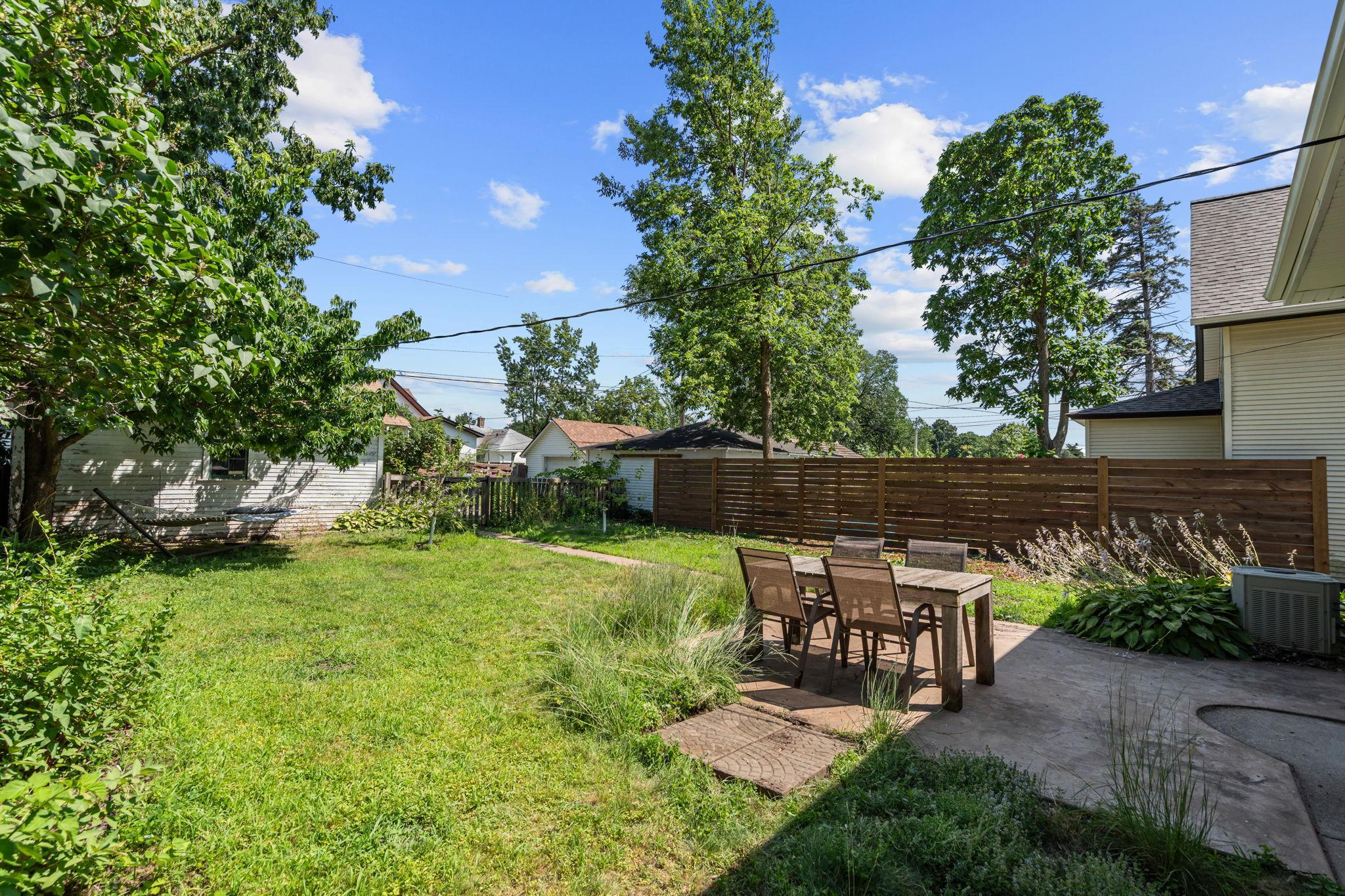 Quiet backyard with pollinator gardens and apple trees