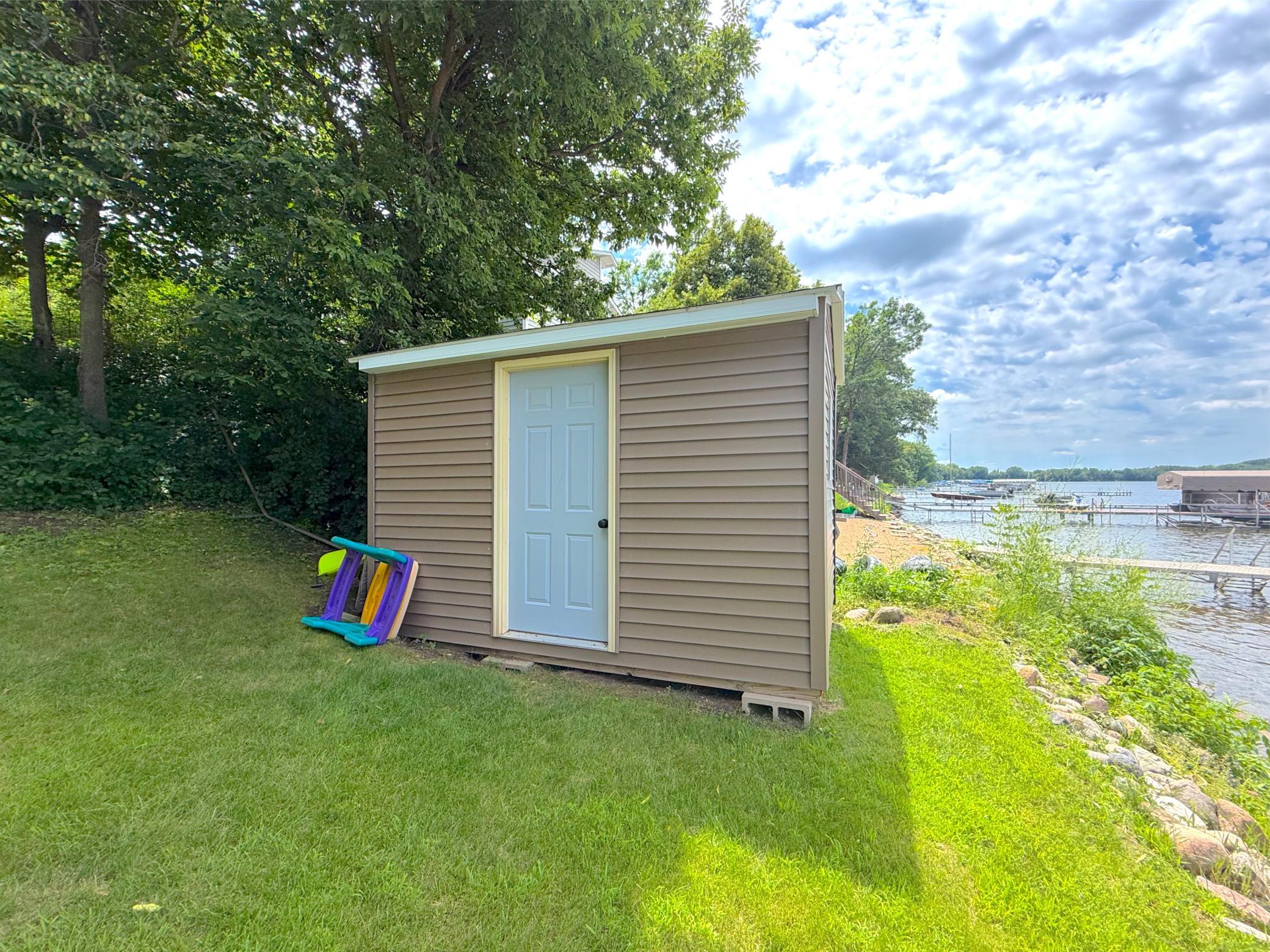 A lakeside storage shed offers the ease of having space to store all your lake toys just steps from waters' edge, what more do you need?