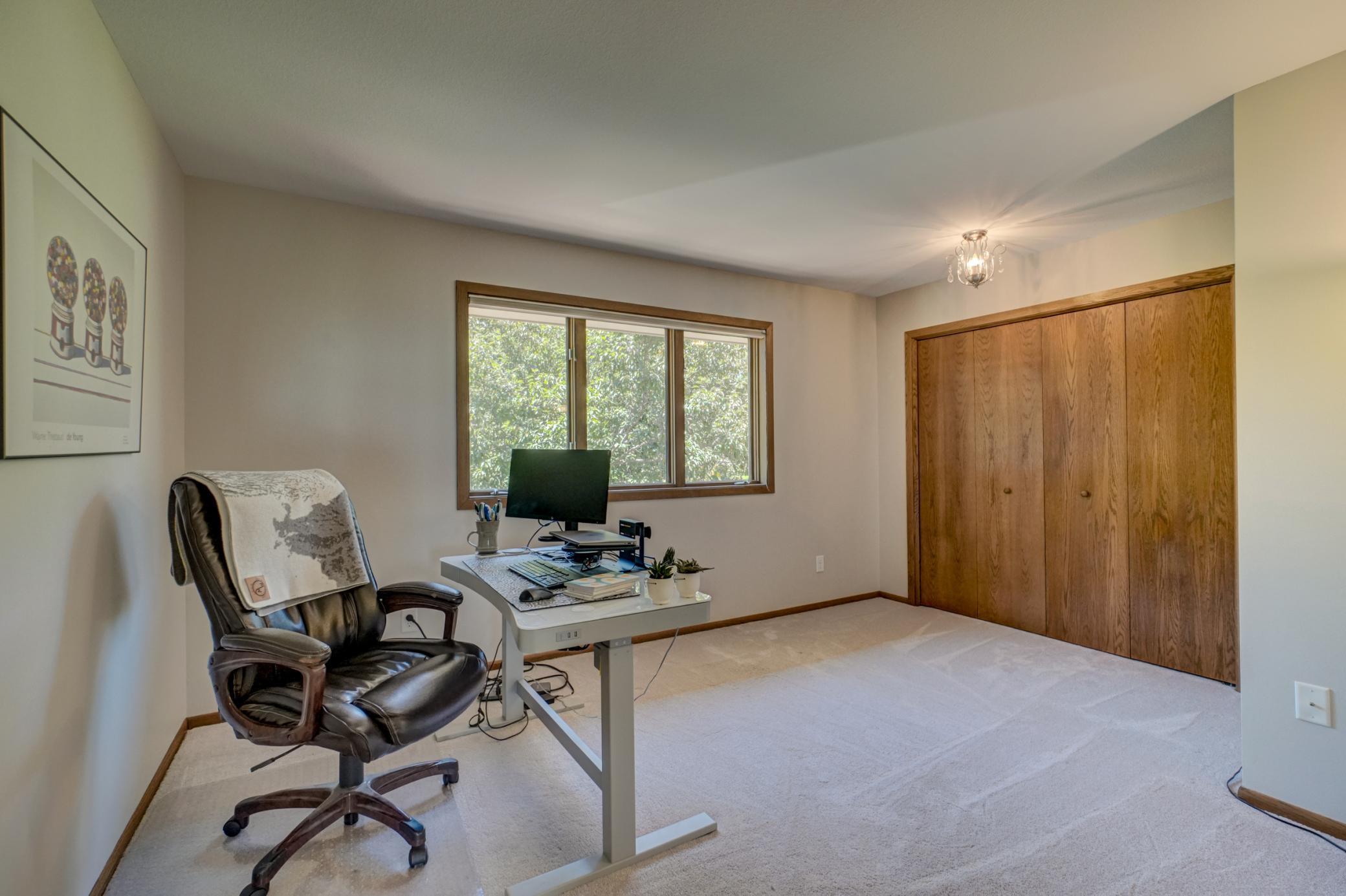 Completing the upper level, this spacious fourth bedroom offers flexibility as a home office, guest room, or hobby space