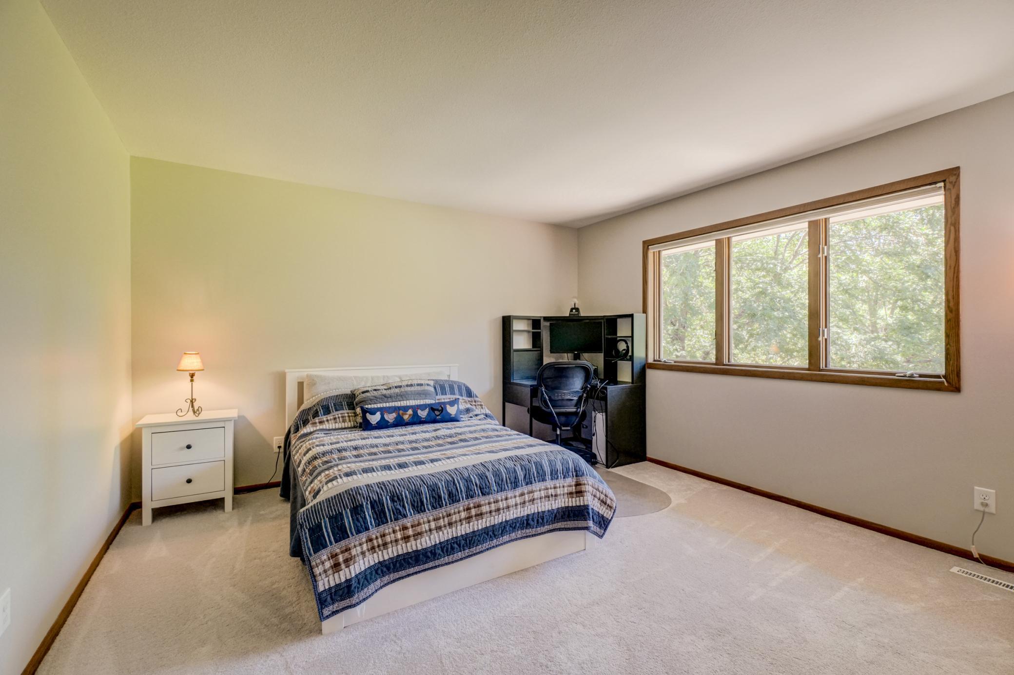 Designed for convenience, this third upper-level bedroom features access to a full walk-through bathroom