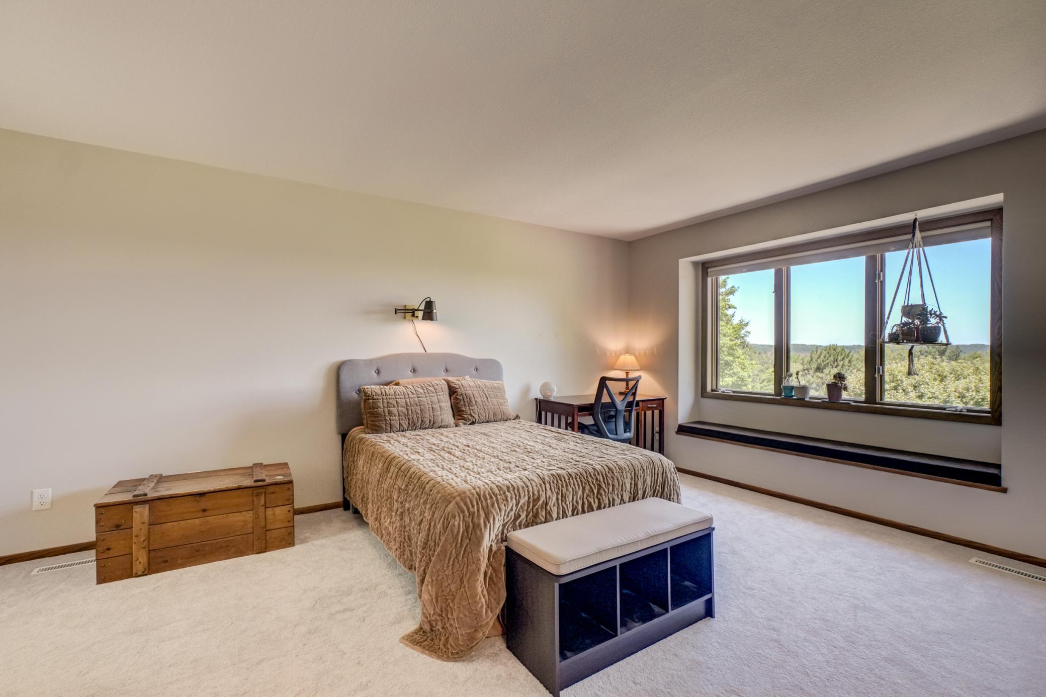 The first of two upper-level junior suites, this inviting retreat features gorgeous scenic views