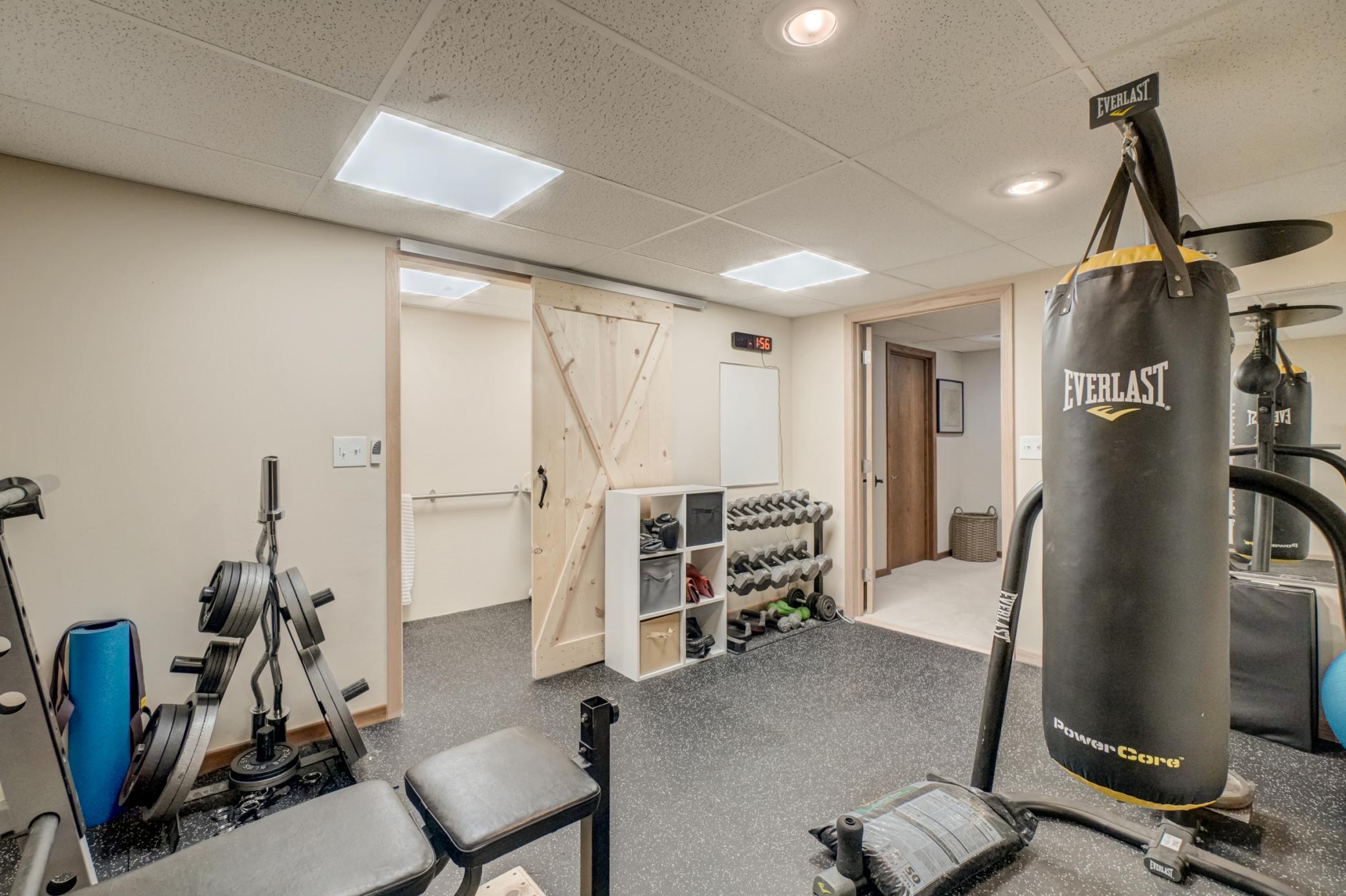 Completing the lower level are a convenient half bath and an expansive workshop with plenty of space for projects and storage