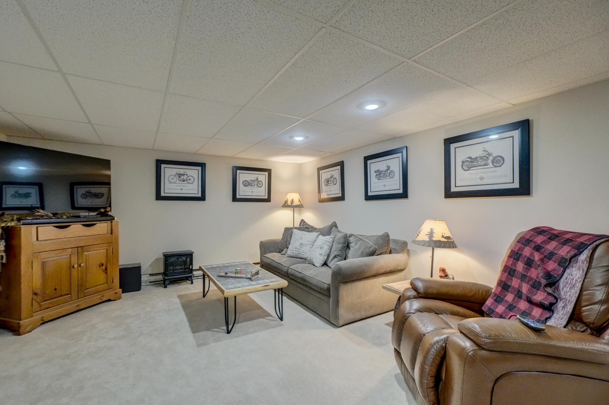 This spacious family room is perfect for movie nights, game days, or entertaining guests