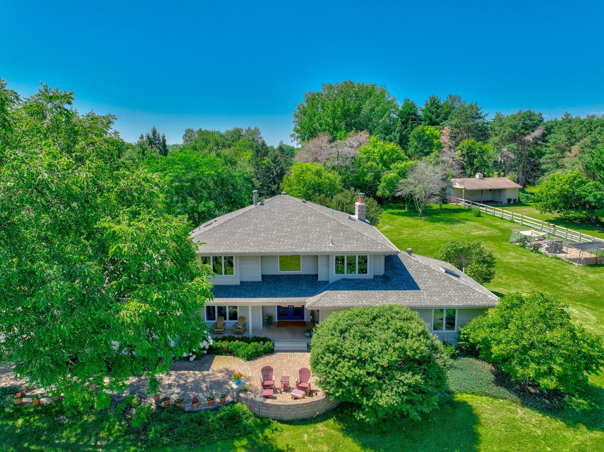 Experience a one-of-a-kind hilltop retreat where panoramic views of the St. Croix River bluffs greet you from the front, while an enchanting equestrian paradise unfolds in the backyard!