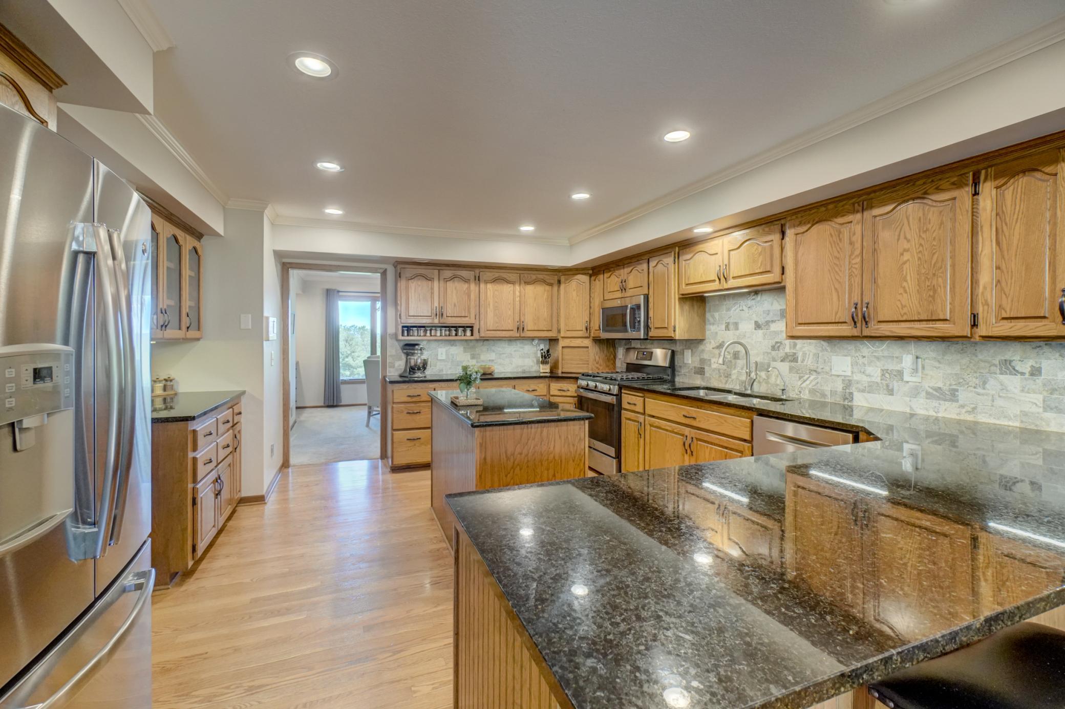 Designed for both everyday living and entertaining, the main level showcases a spacious center island kitchen