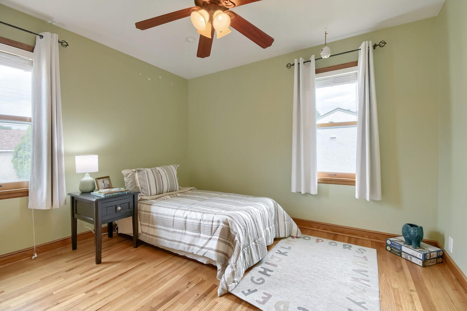 First bedroom on the main level with that stunning hardwood.