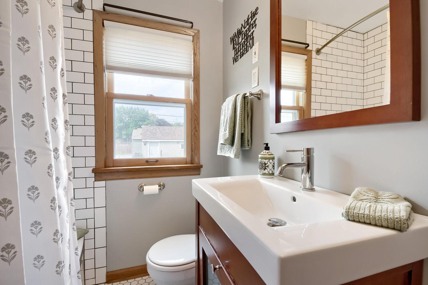 Main floor bathroom offers subway tile, a great base for any bathroom color scheme.