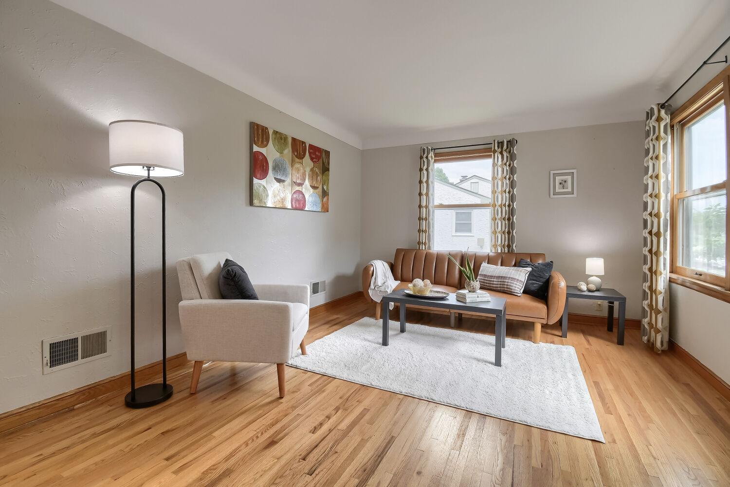 Stunning hardwood floors with east facing front windows that sun drench the heart of the home.
