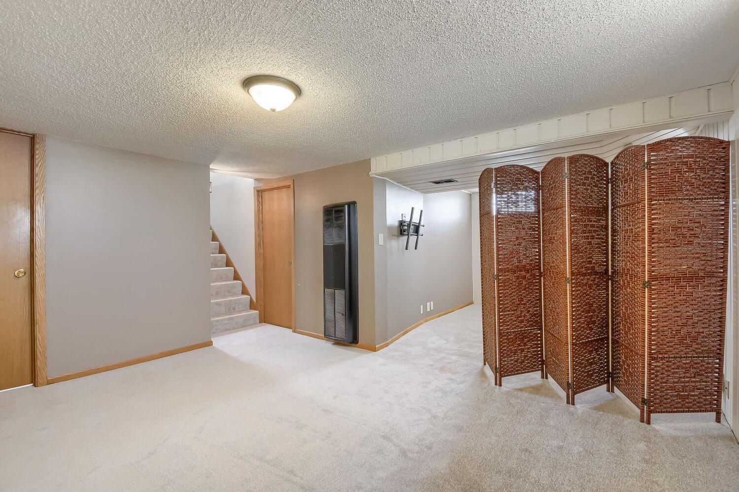 The lower level has brand new carpet. Could be a large family room or family room/office.