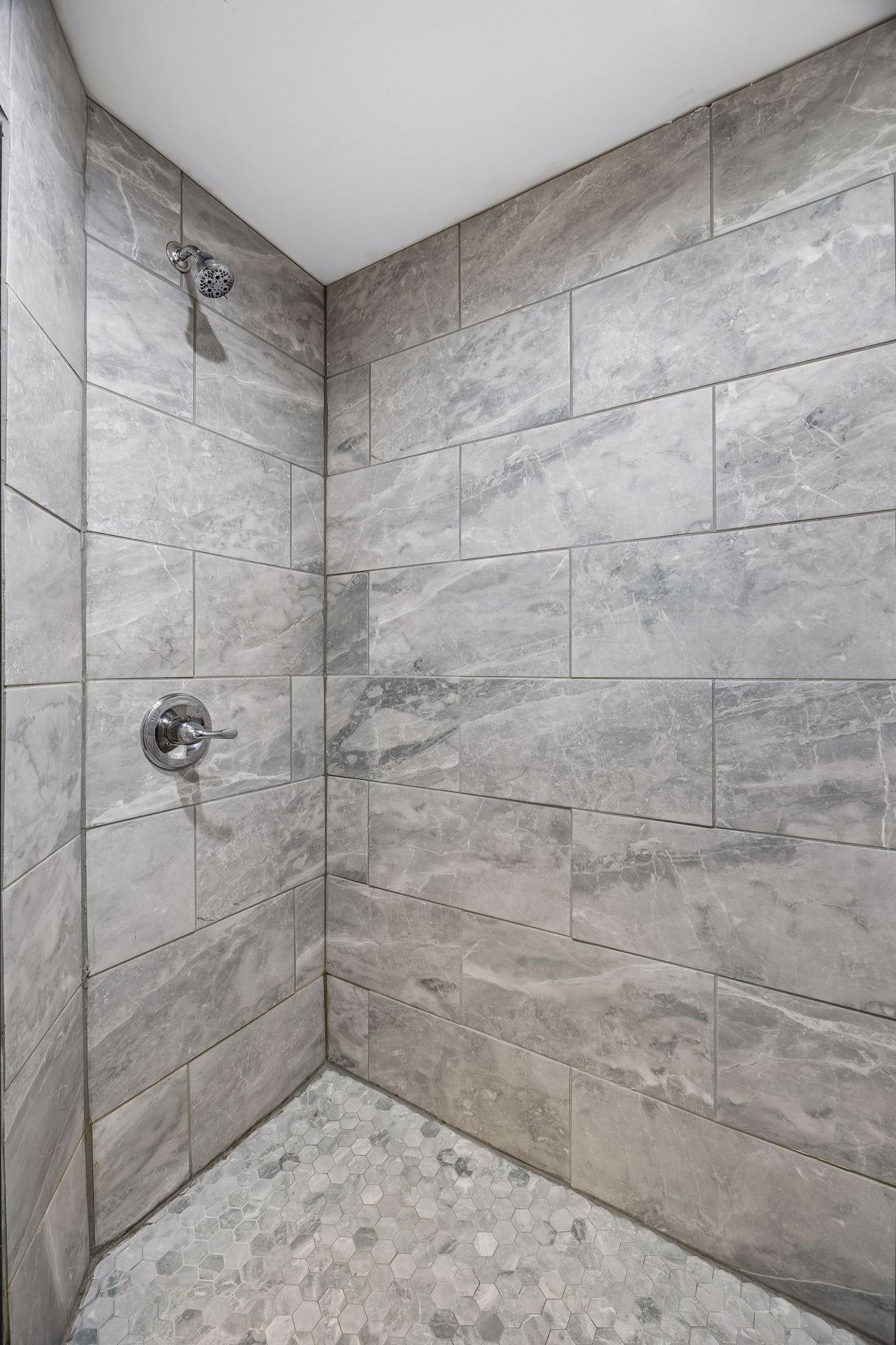 You'll love the beautiful walk-in shower in the guest suite