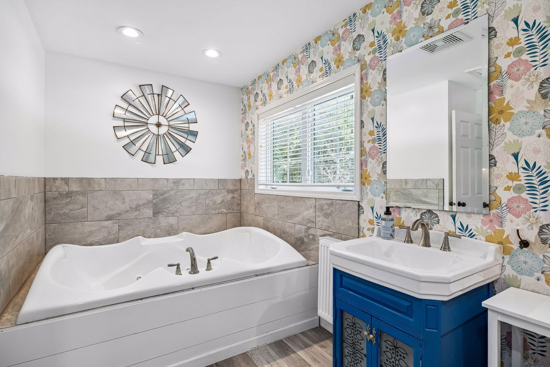 The full bathroom in the guest suite has a huge jetted tub