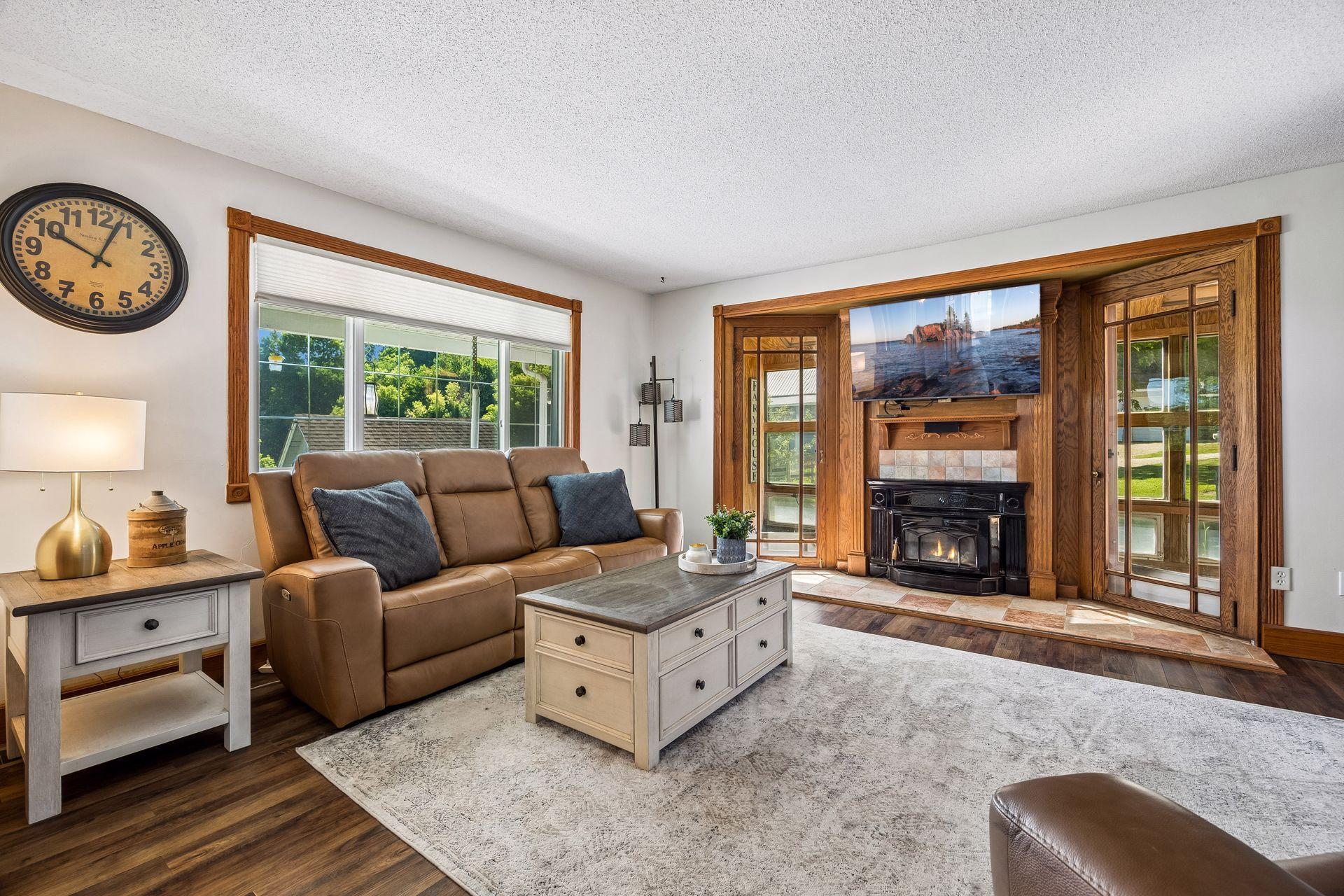 The large living room window overlooks the beauty of the farm