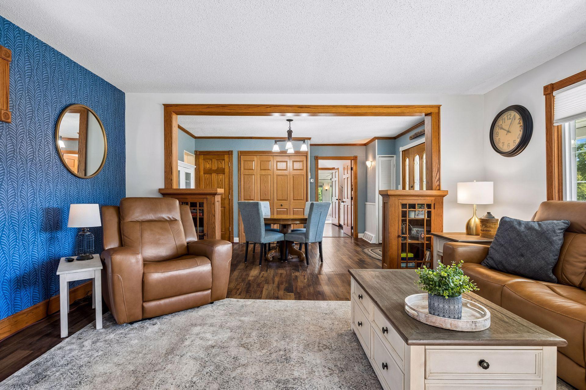Living room, dining room, and main level primary suite