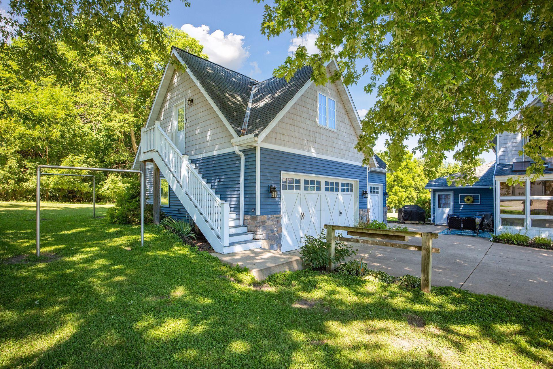 The detached-3 car garage with the guest suite above. It has been used as a successful short-term rental since 2022.