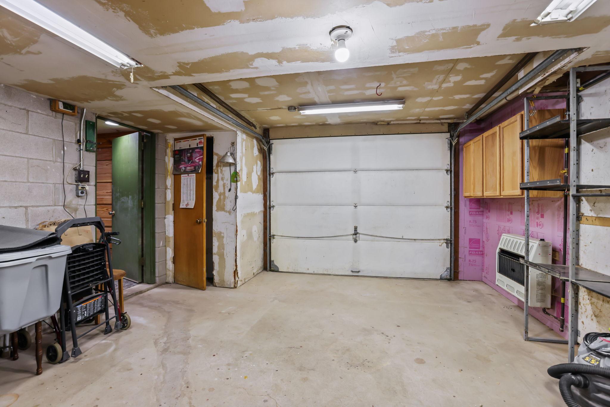 Door separates workshop space from the main garage.