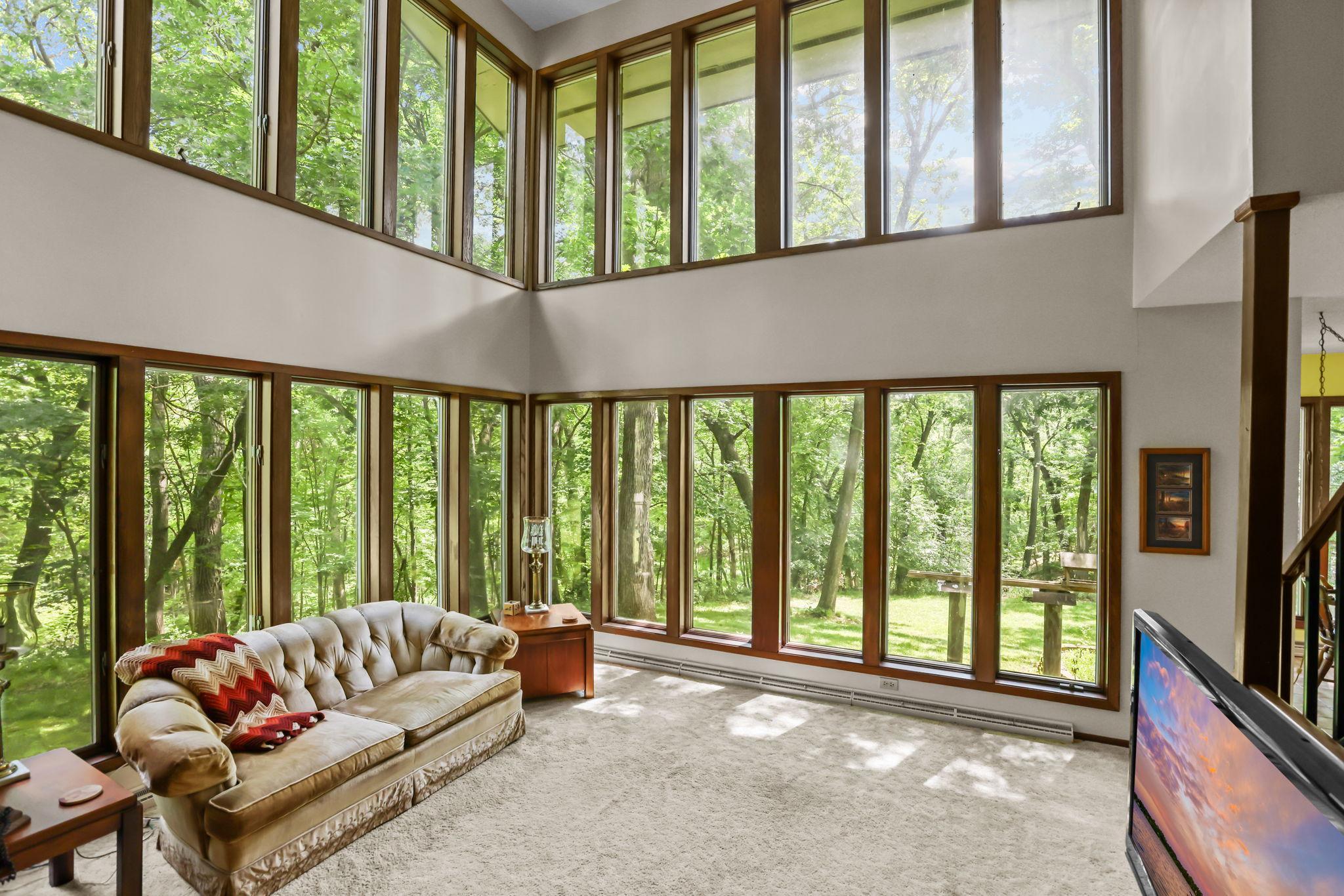 Nature practially in your living room! Walls of windows provide natural light.