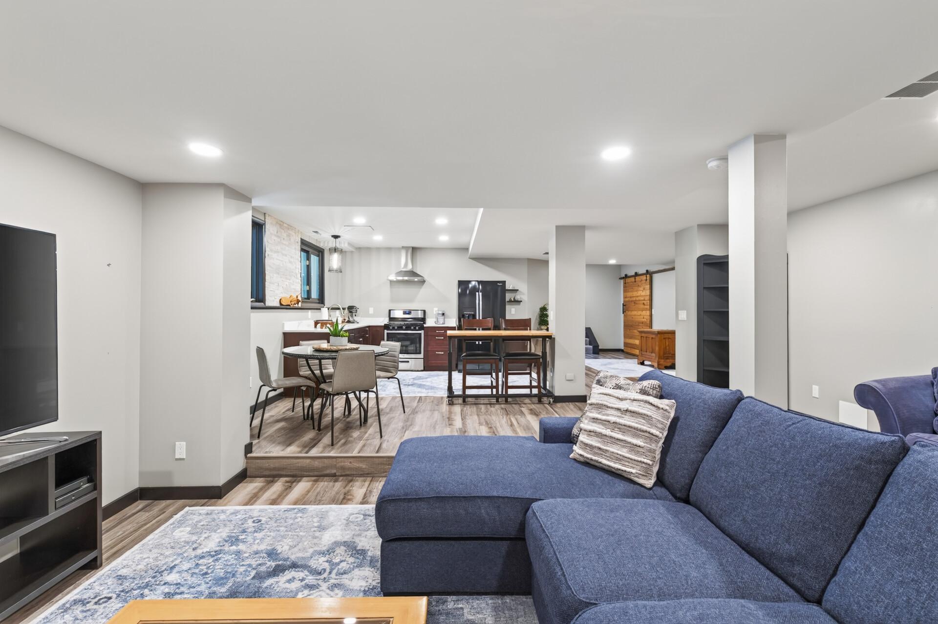 A spacious second living area provides room for guests to gather, dine, and relax.