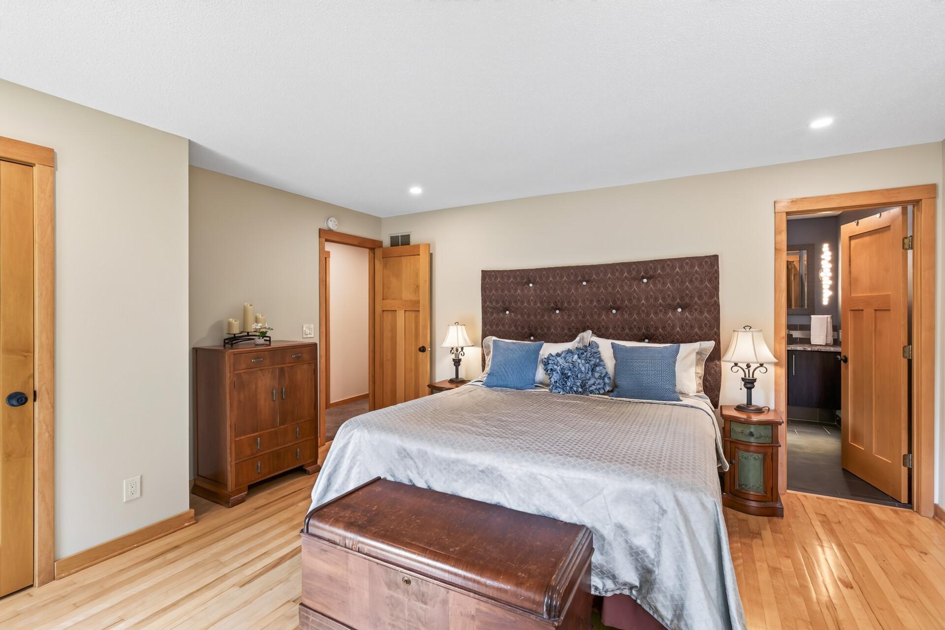 The spacious primary bedroom offers a peaceful place to relax and recharge.