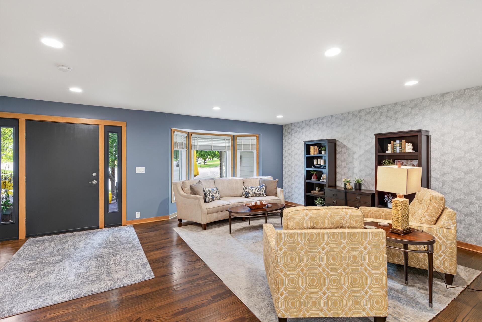 The expansive living room offers multiple conversation areas and plenty of room to entertain.
