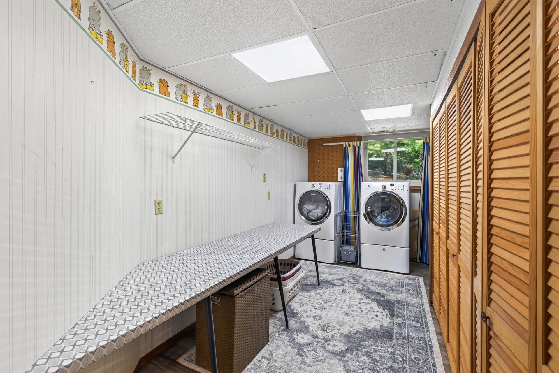 Oversized 16x10 laundry room with excellent workspace and additional storage.