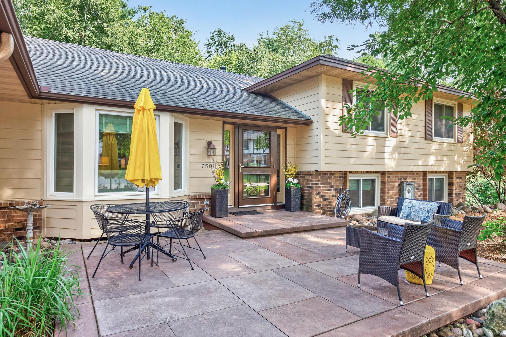 A spacious front patio provides the perfect setting for outdoor dining, summer gatherings, and evenings with friends!