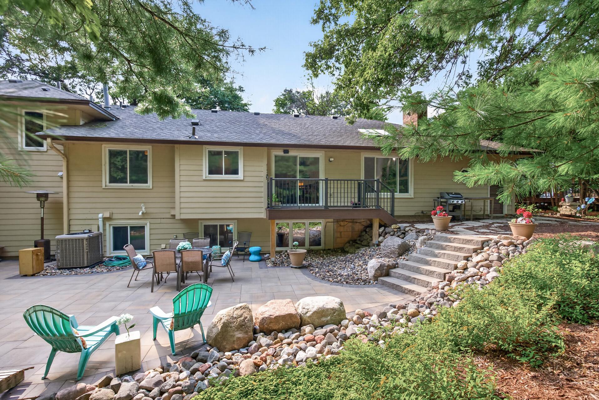 Thoughtfully designed outdoor spaces offer plenty of room to relax, entertain, and enjoy the beautiful wooded surroundings.
