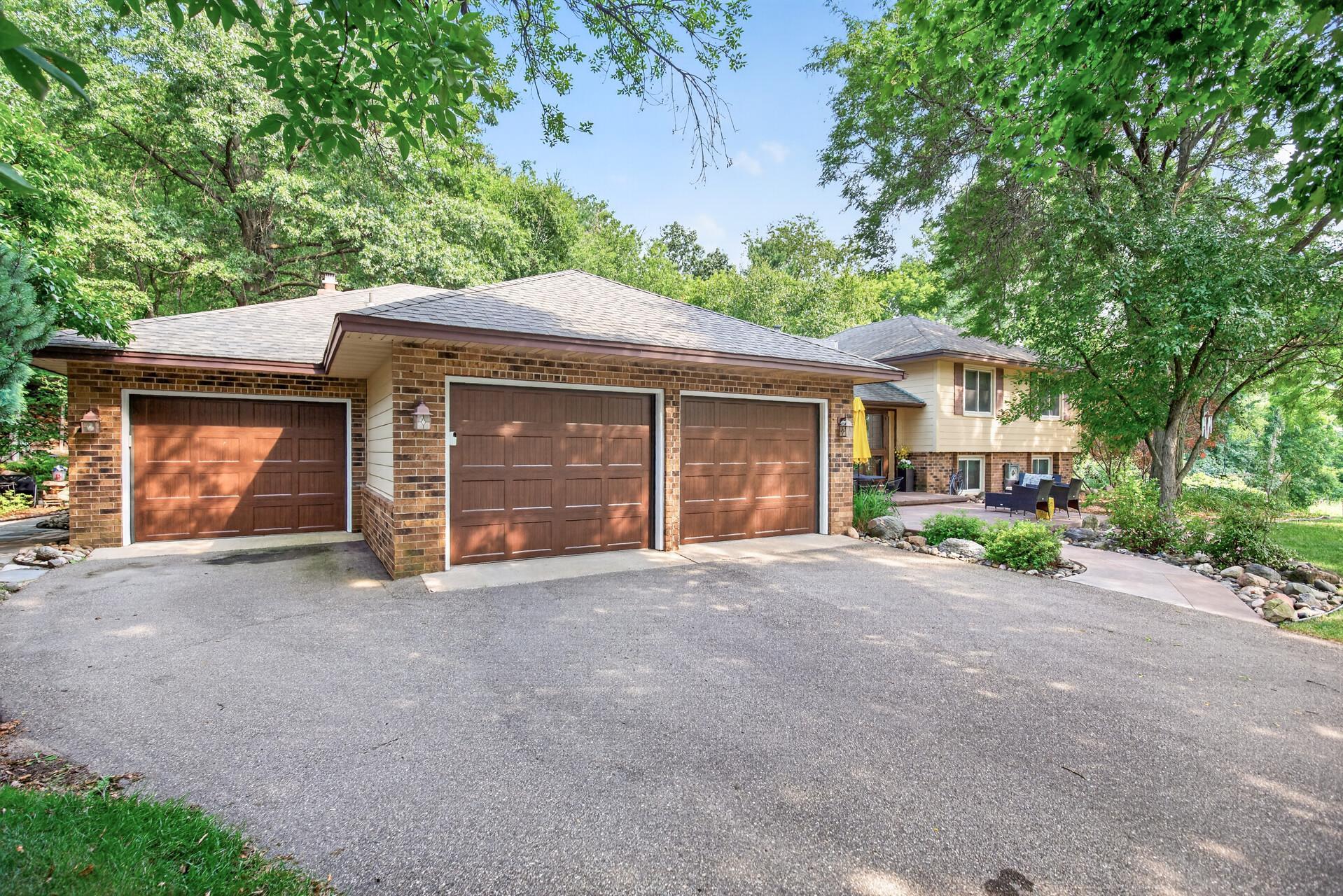 Three stall garage capacity, including a double-deep third stall for vehicles, recreational equipment, storage, or workspace.