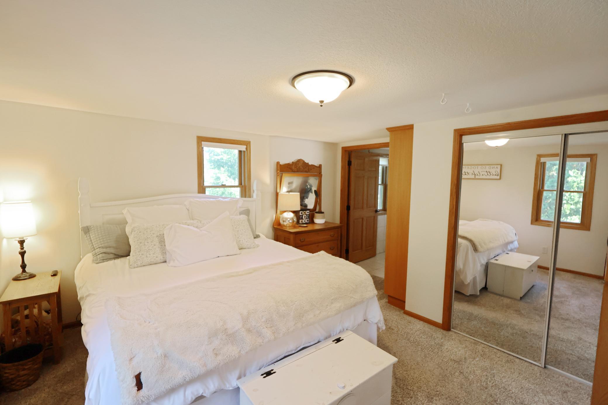 Spacious and bright main floor primary bedroom.