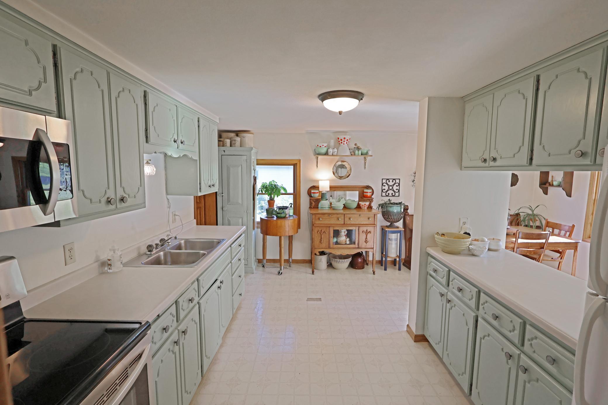 The kitchen area offers lots of cabinet and counter space.