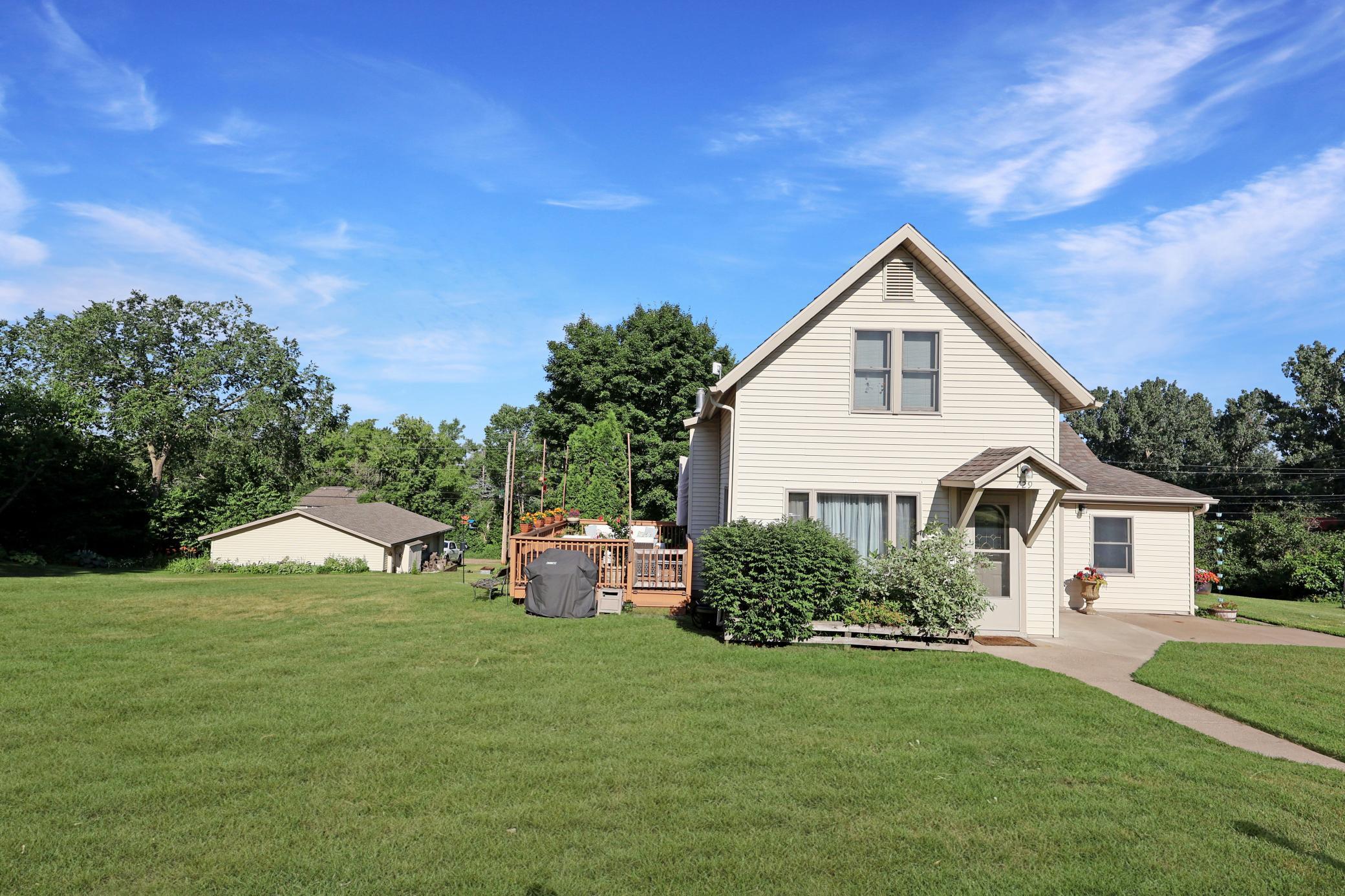Maintenance free exterior with a great deck area, huge triple lot, and 2 stall detached garage.
