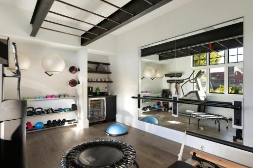 Extensive fitness room off the primary suite. This could be converted to a 4th upper level bedroom with a door added to the hallway.