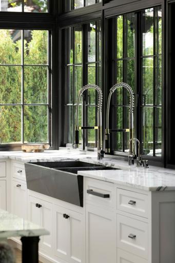 Kitchen overlooking backyard patio, pool and gardens