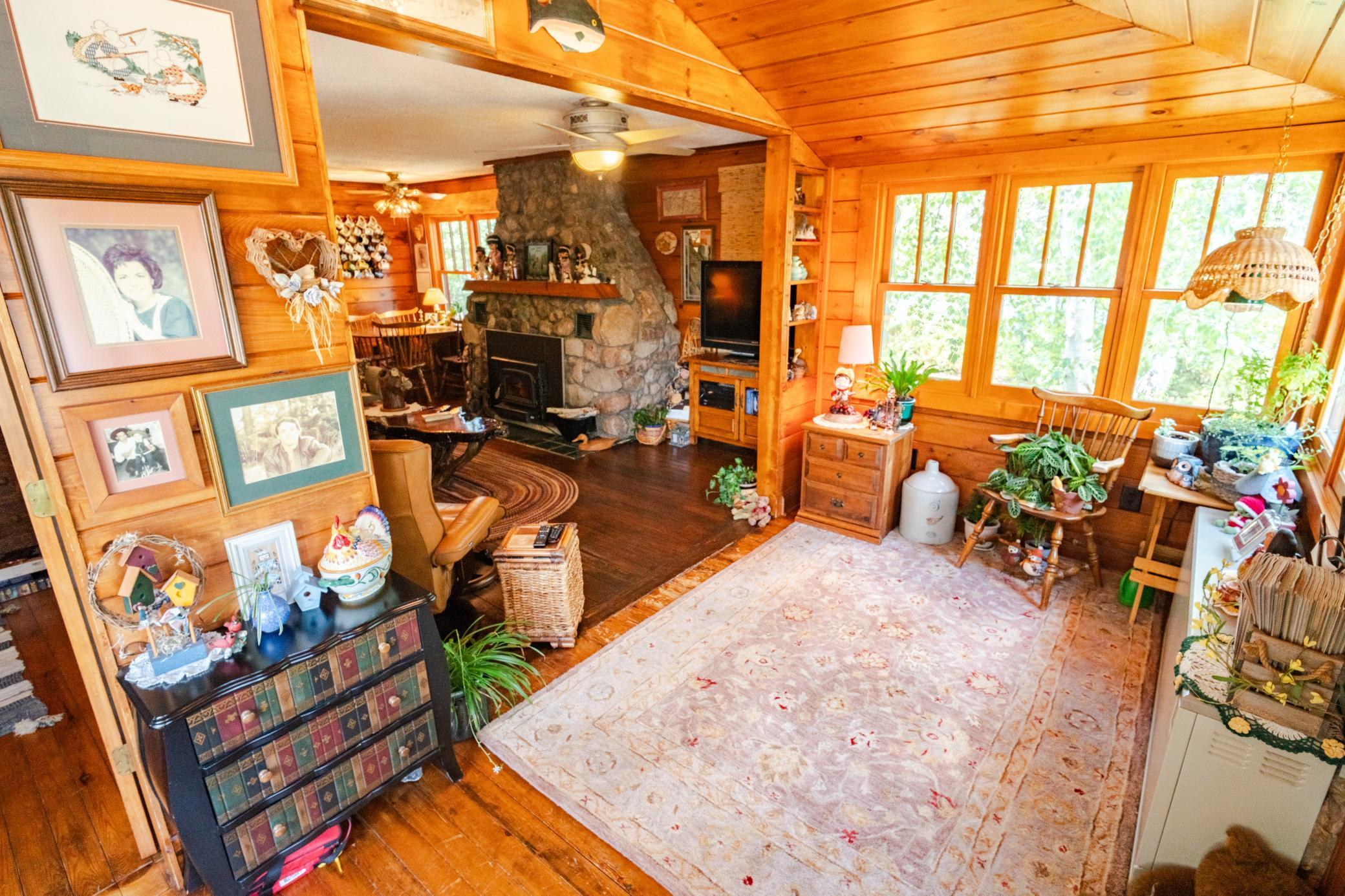 Main cabin interior with grand stone fireplace