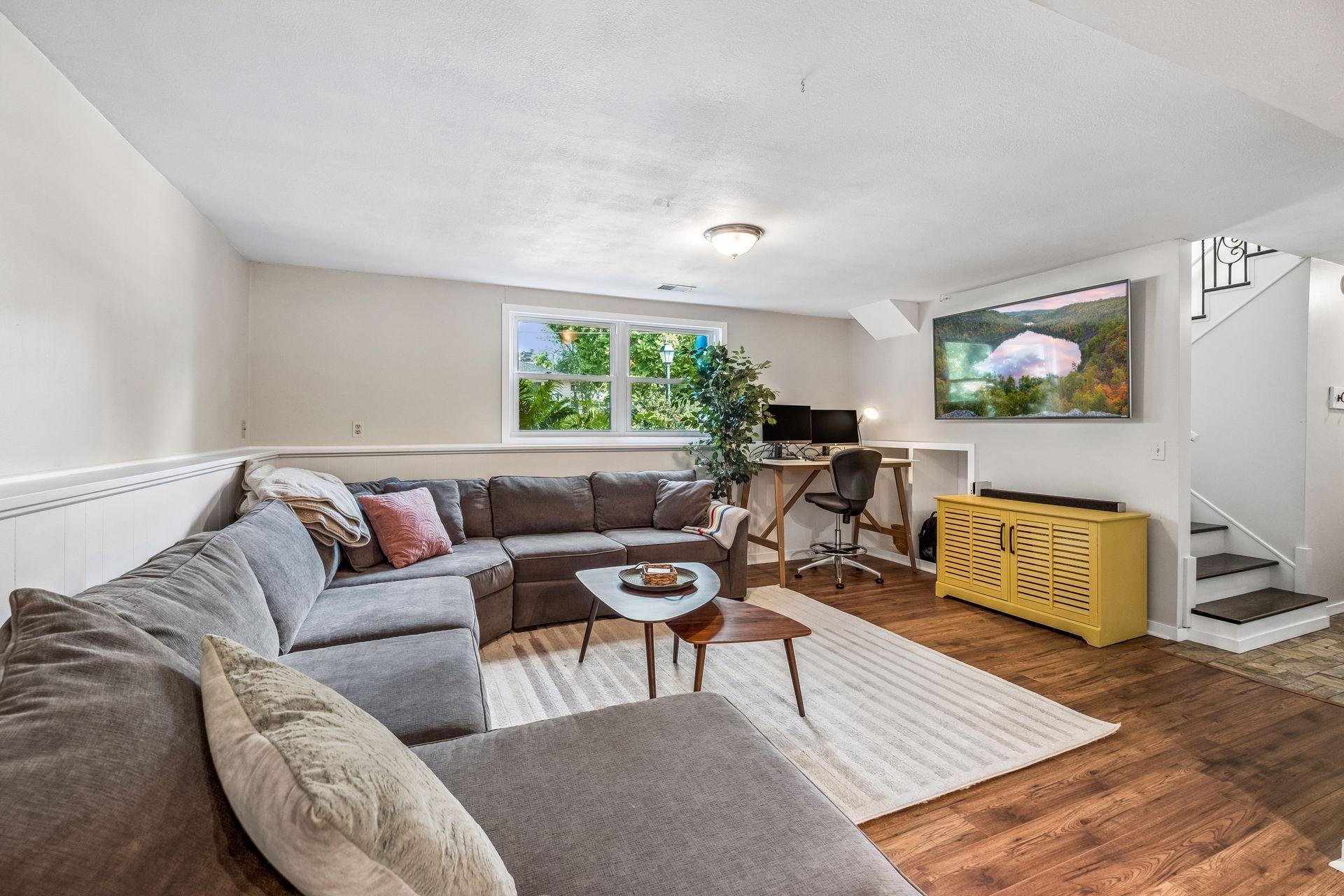 Wonderful lower level family room with updated flooring