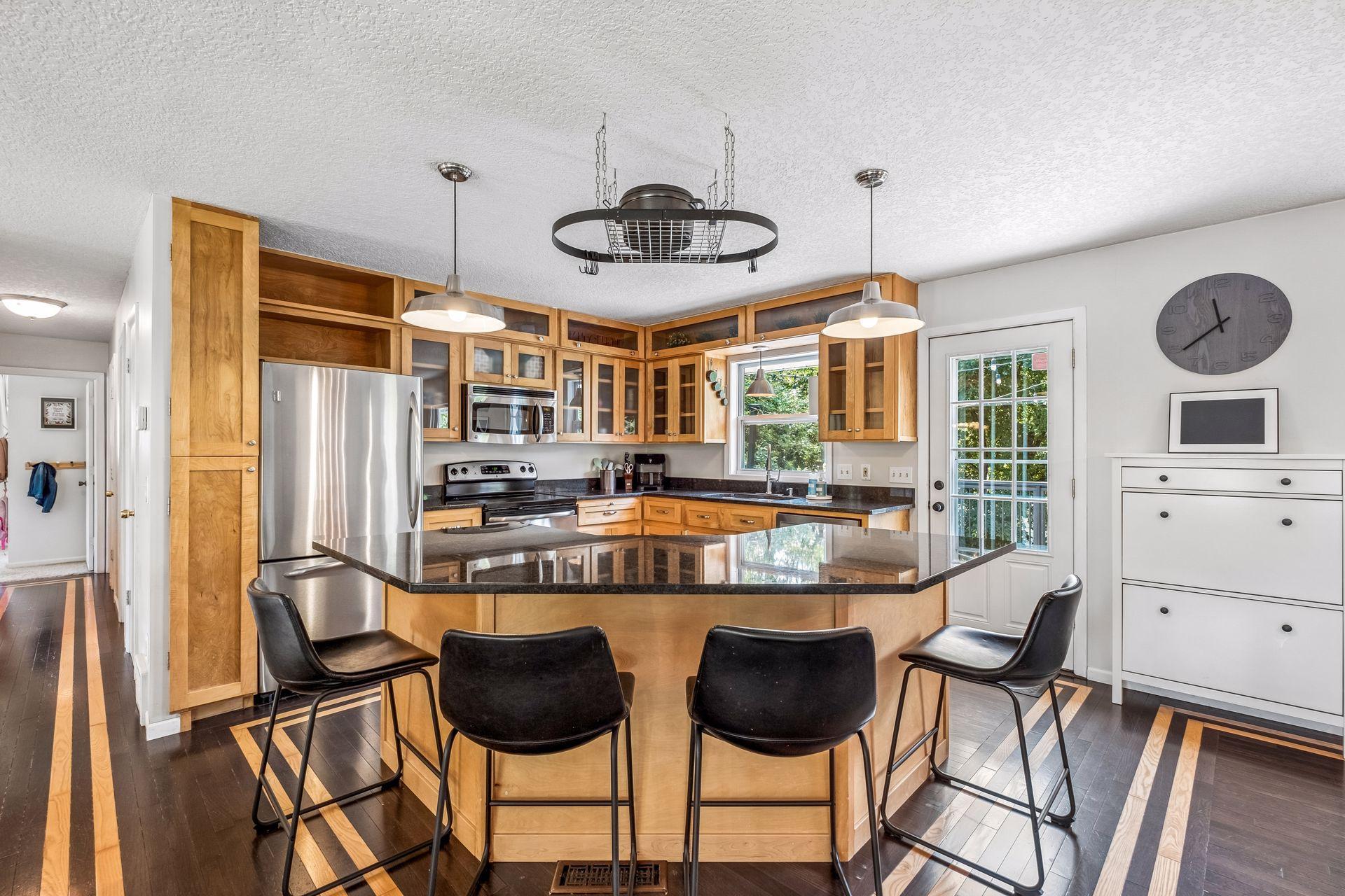 Fabulous kitchen with center island opens to large deck