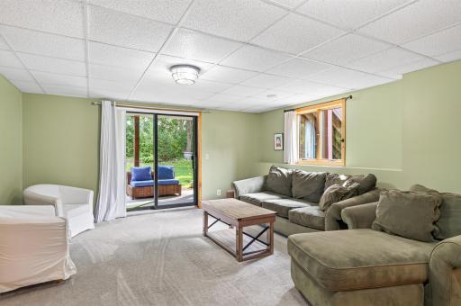 Even the lower level is light filled and walkouts to your private oasis
