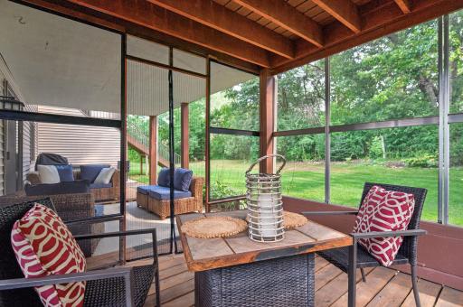 Screened in lower level porch just might be your second favorite space in this gorgeous home