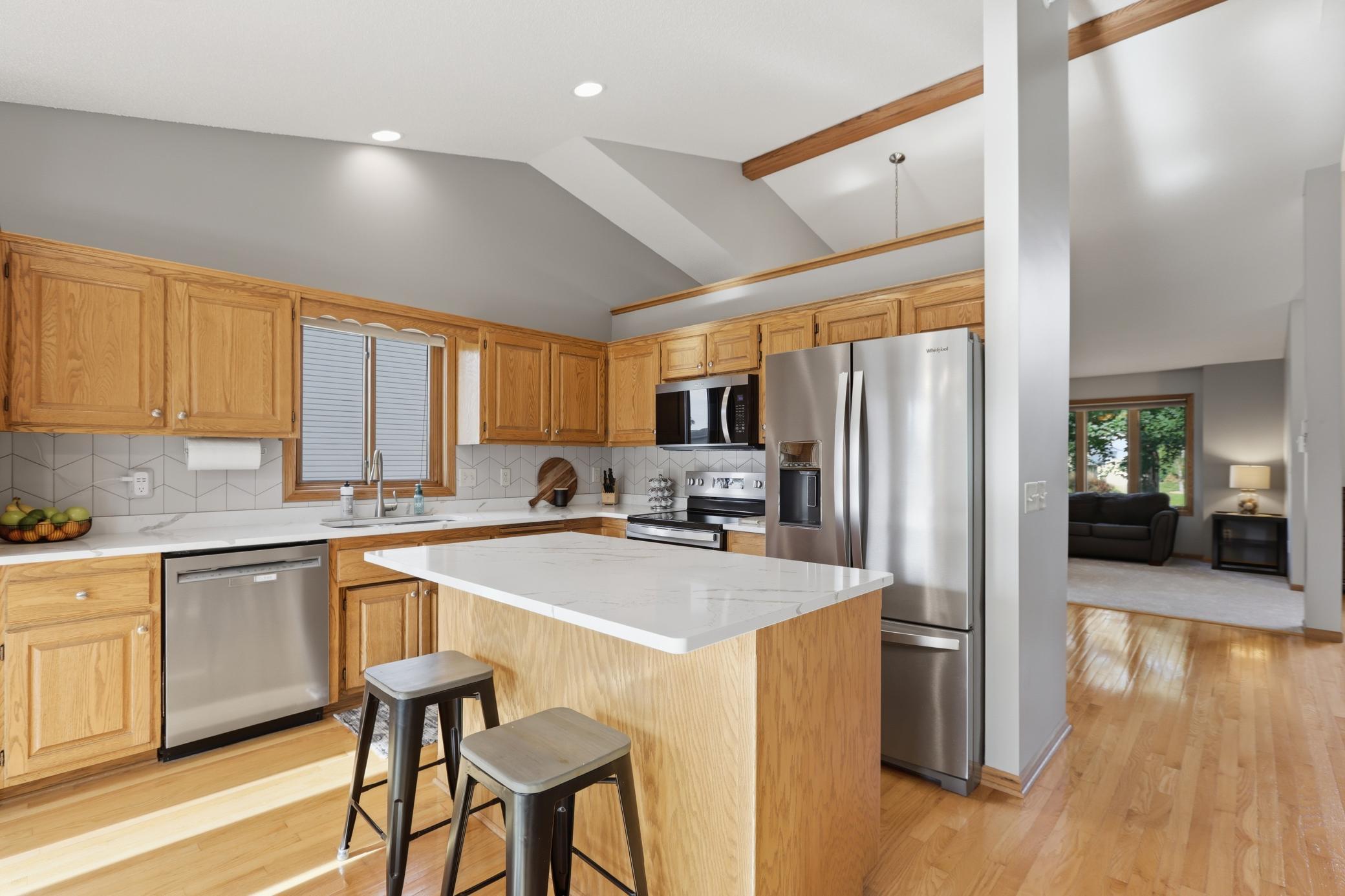 Fully Updated Kitchen Featuring Quartz Countertops and New Stainless Steel Appliances