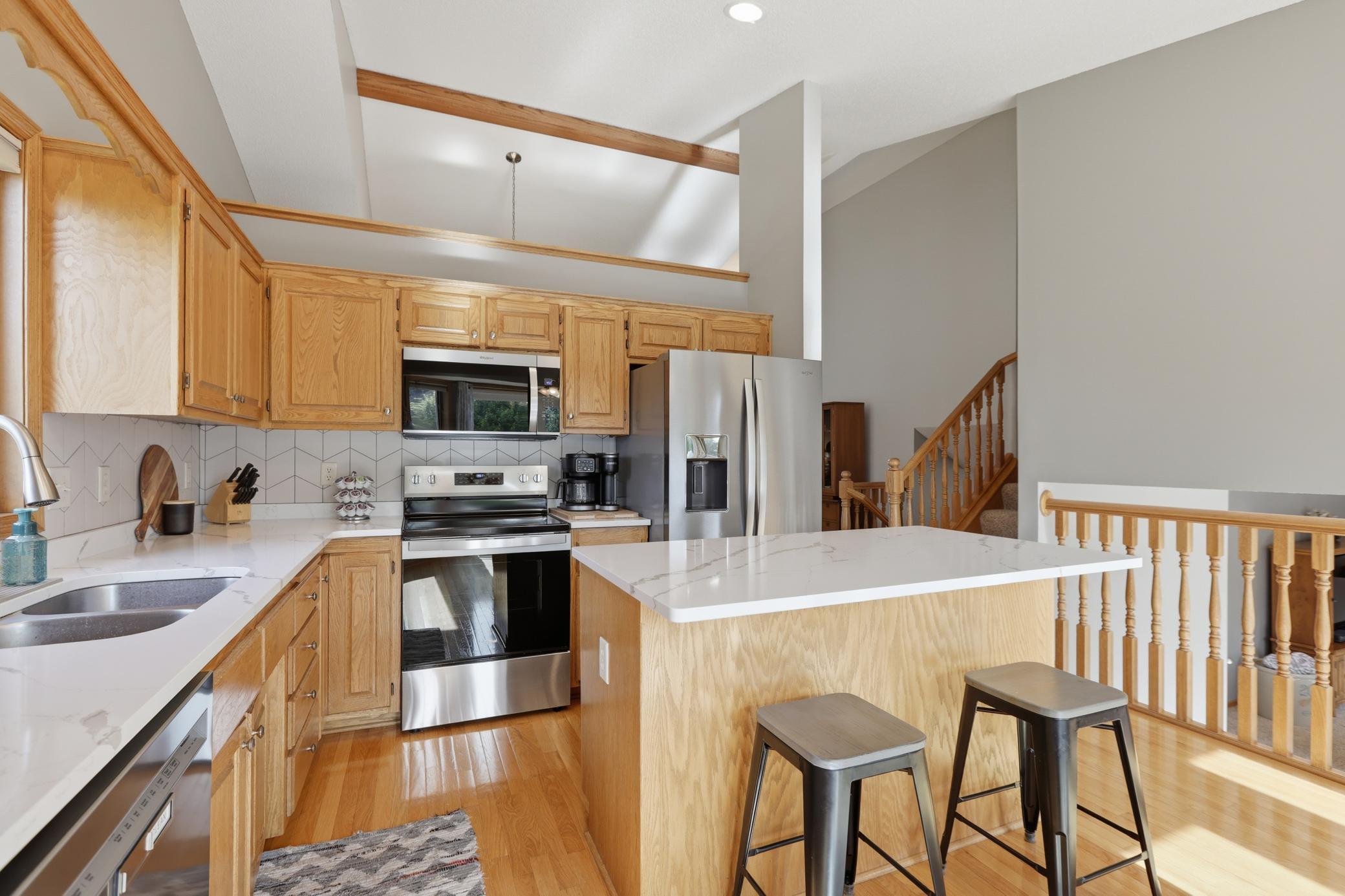 Fully Updated Kitchen Featuring Quartz Countertops and New Stainless Steel Appliances