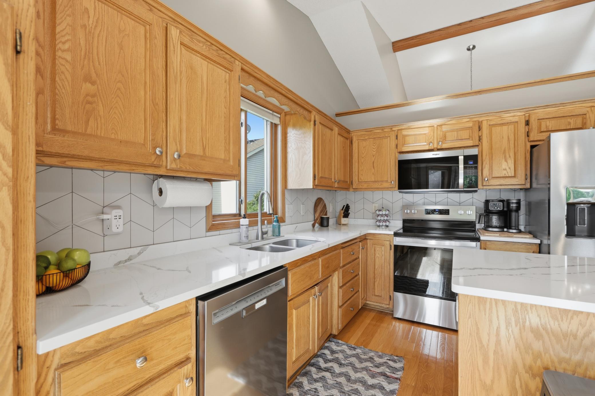 Fully Updated Kitchen Featuring Quartz Countertops and New Stainless Steel Appliances