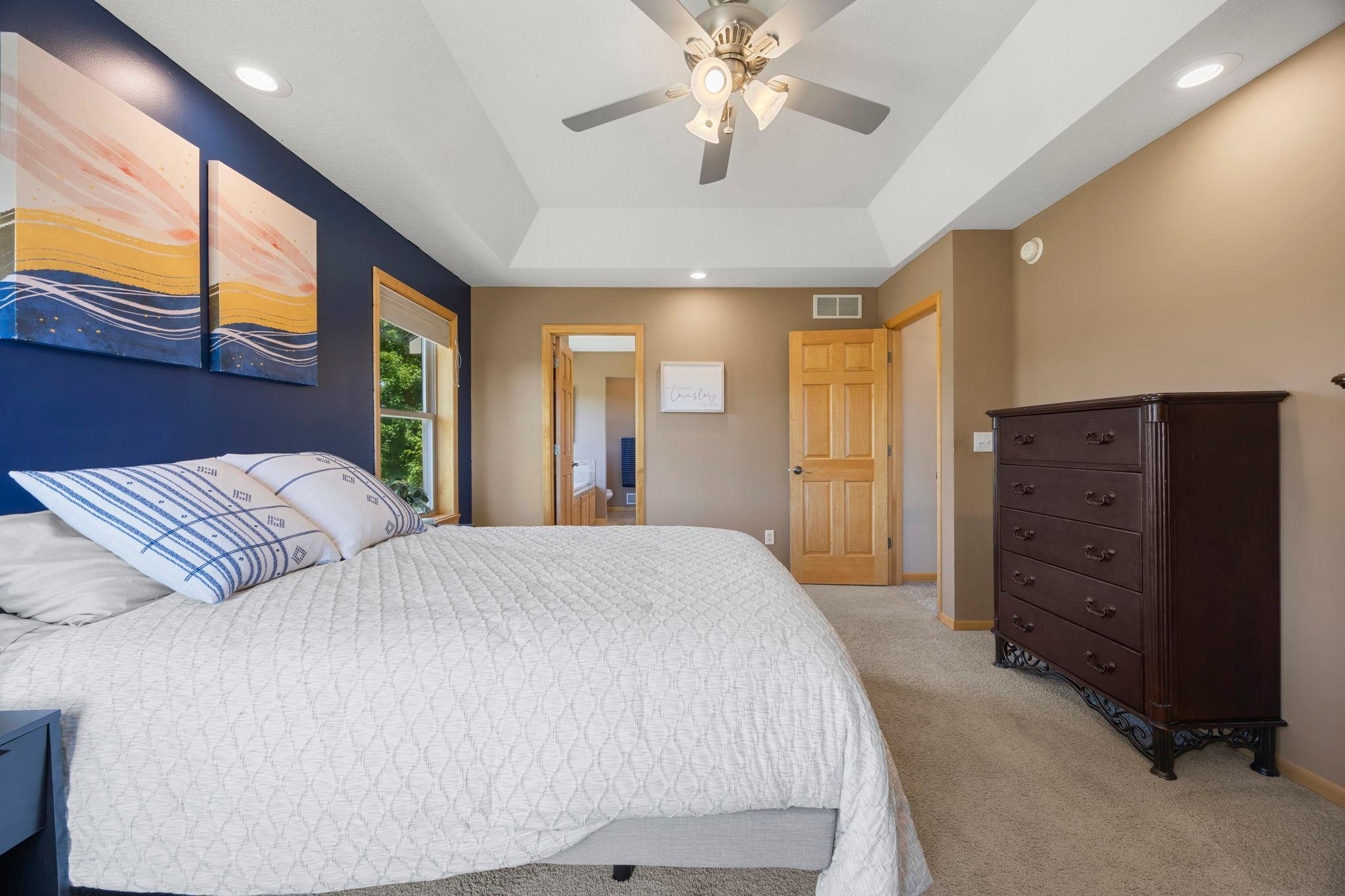 Large primary bedroom with vaulted ceiling