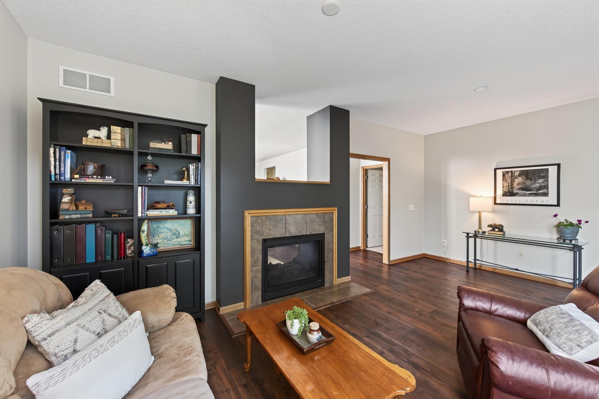 The sunroom offers a gas fireplace that you can cozy by! There is event the most perfect spot for a puzzle table!