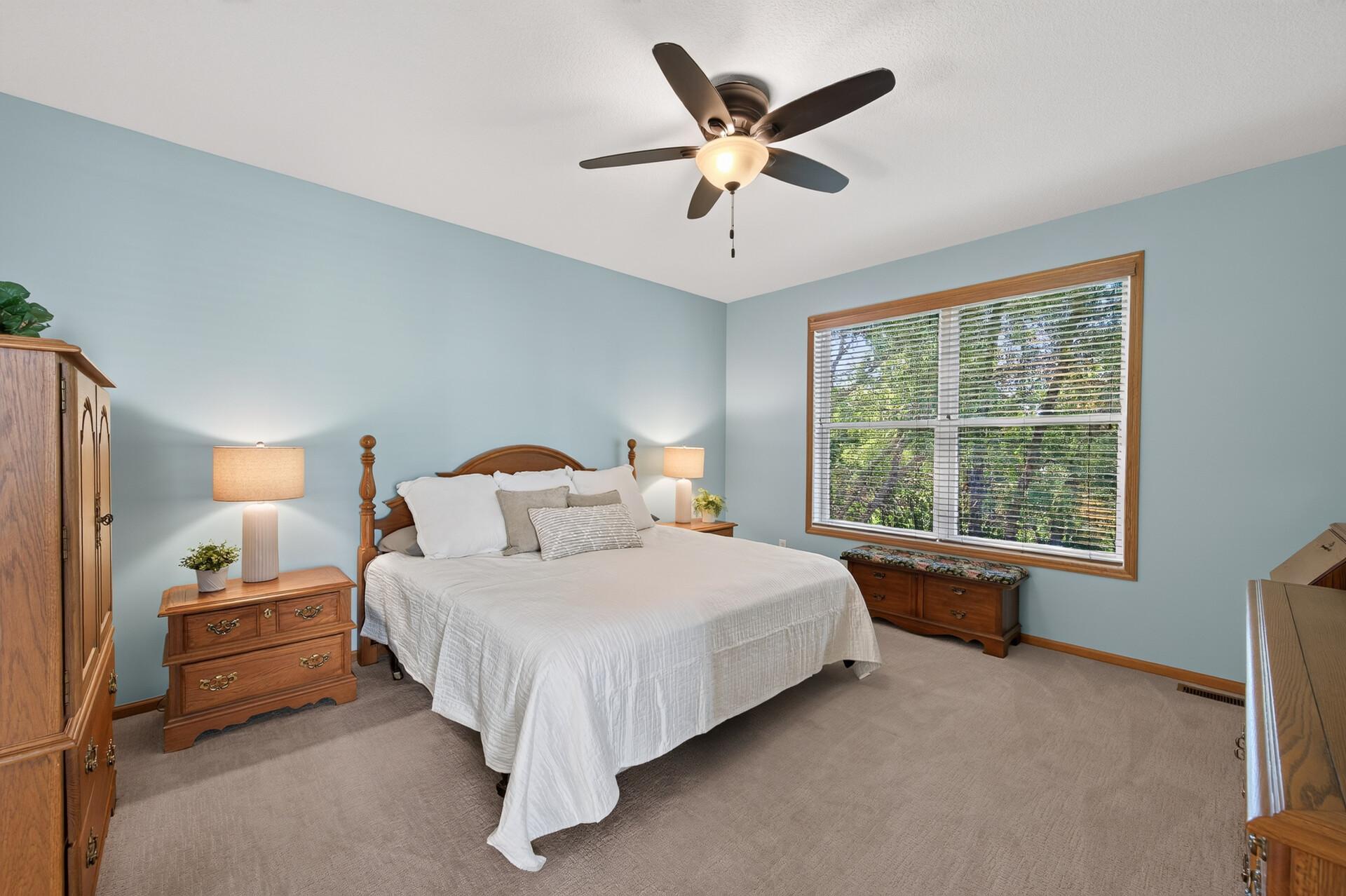 Primary bedroom suite with private bathroom and walk-in closet.