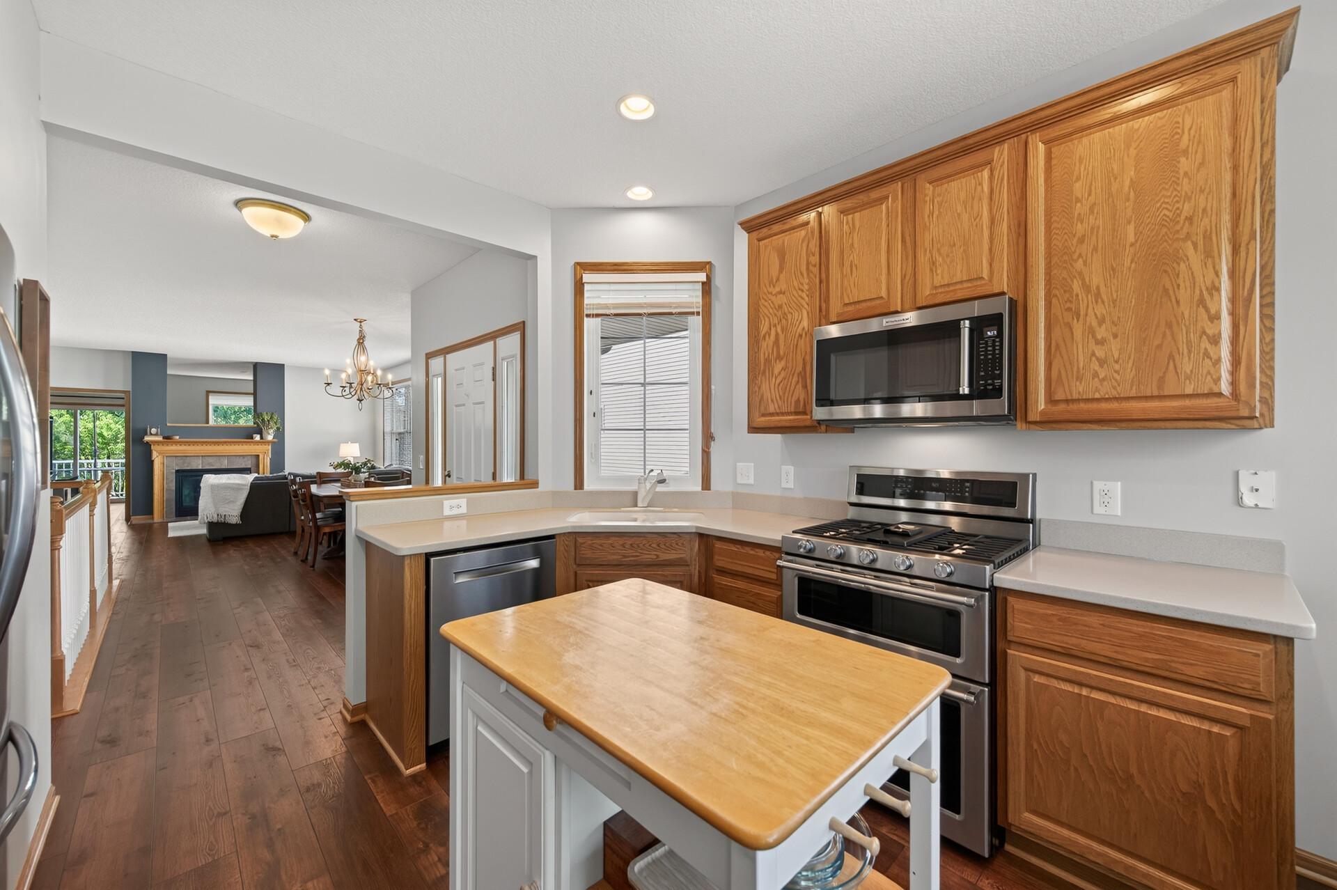 The open floor plan is the heart of this home — a seamless flow that keeps everyone connected whether you are hosting a dinner party or just enjoying a quiet evening in. Look at those gleaming floors!