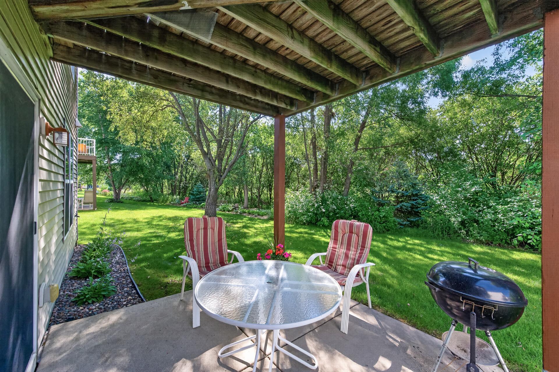 Lower level patio offers backyard fun! You have a flat back yard with space for yard games! And check out the privacy, you can see how every neighbor puts their spin on the landscaping!