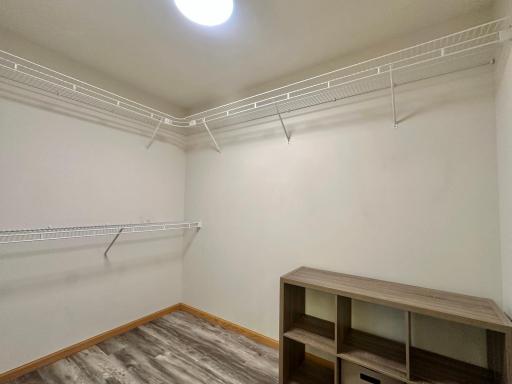 This walk in closet has a ton of room for most of your extras.