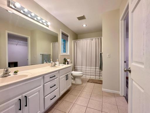 The owners suite has tile floors as well along with double sinks and hard surface counter top.