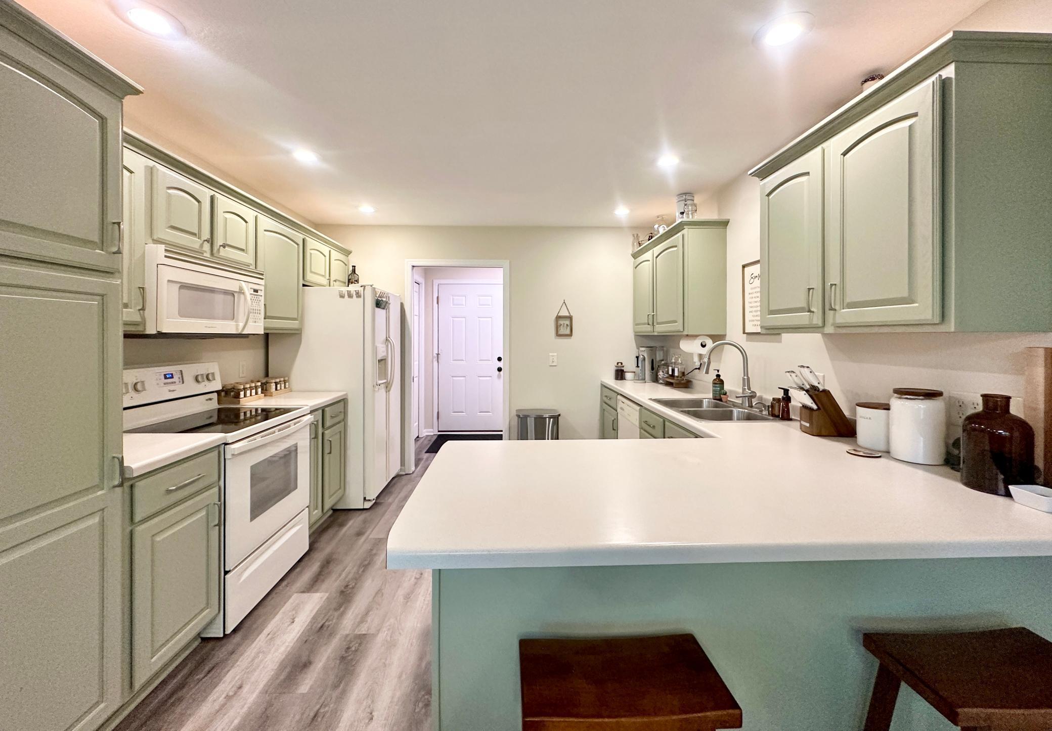 Lots of counter space and counter space in this roomy kitchen.