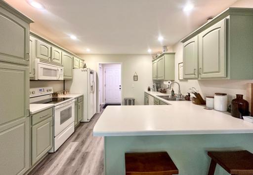 Lots of counter space and counter space in this roomy kitchen.