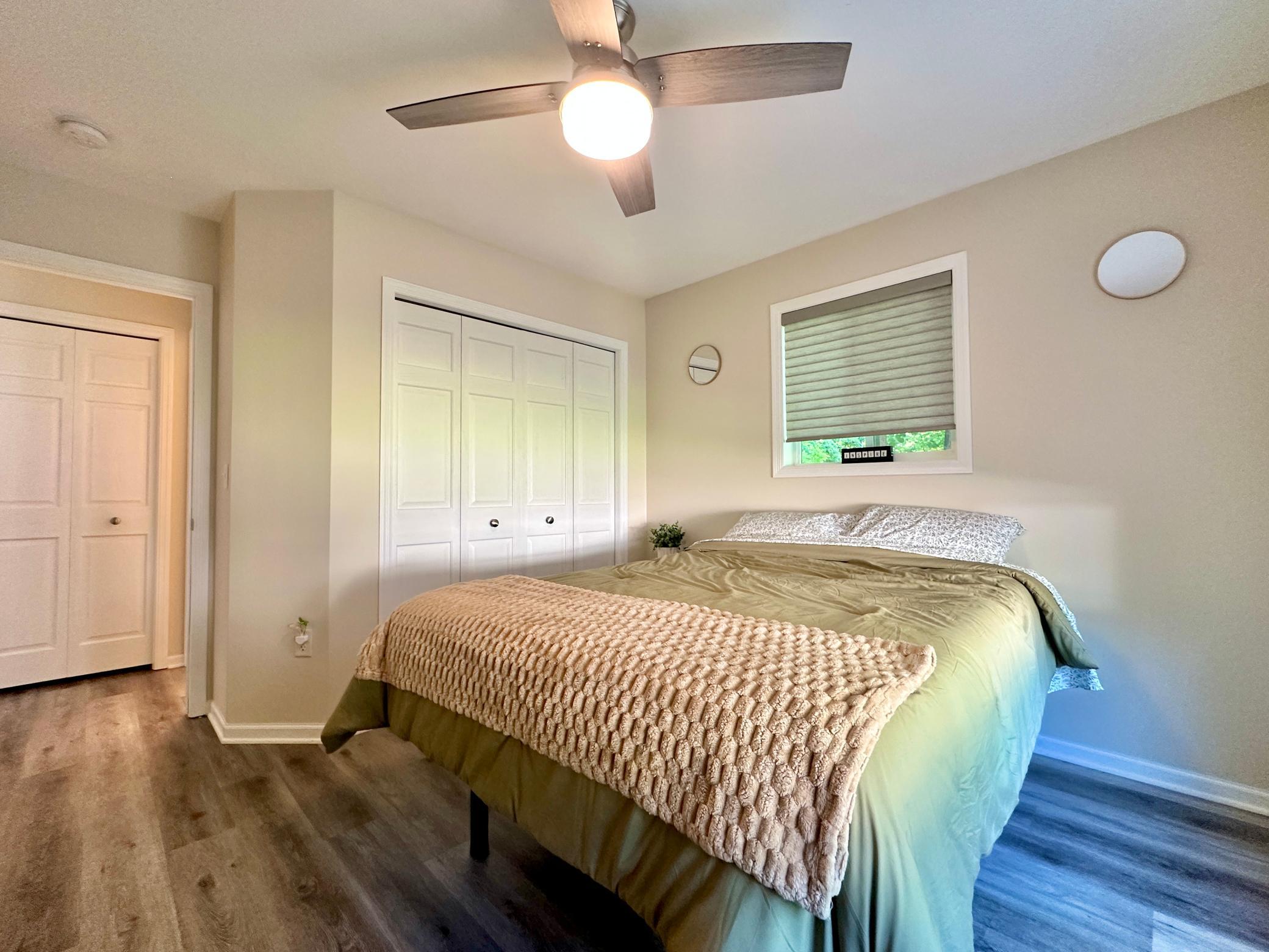 Another look at the first bed room with view into the hall by the bath.